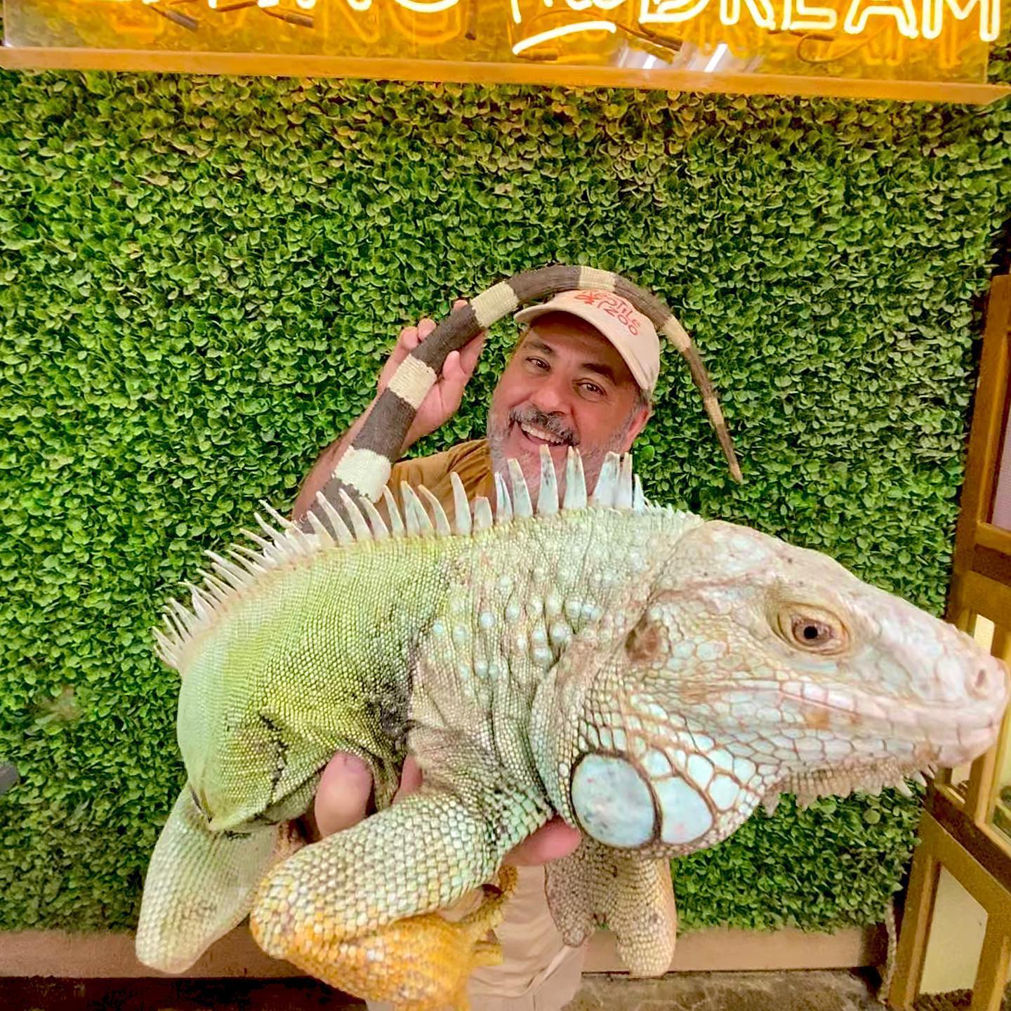 Jay Prehistoric holding a large Iguana