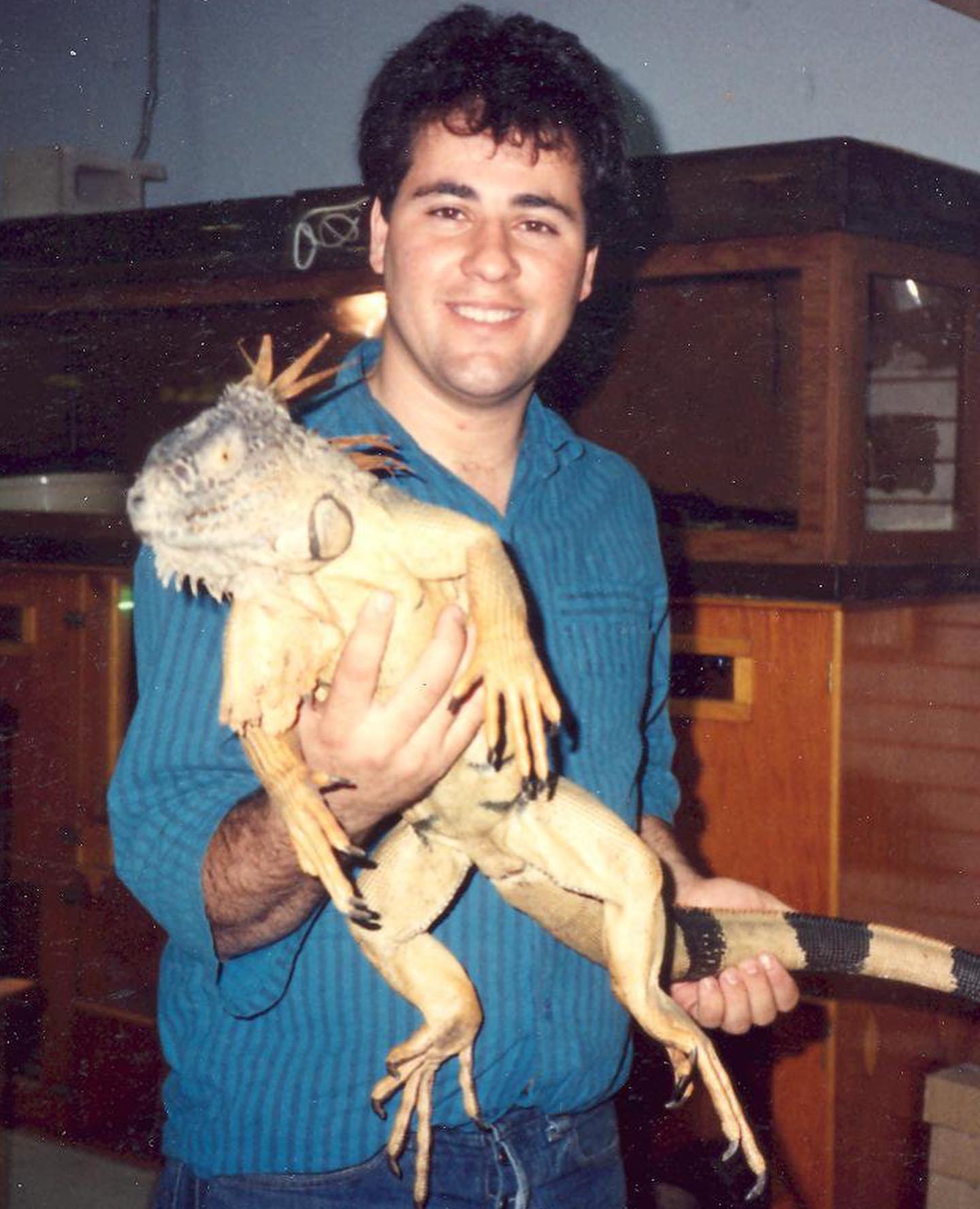 A young Jay Prehistoric holding up an iguana